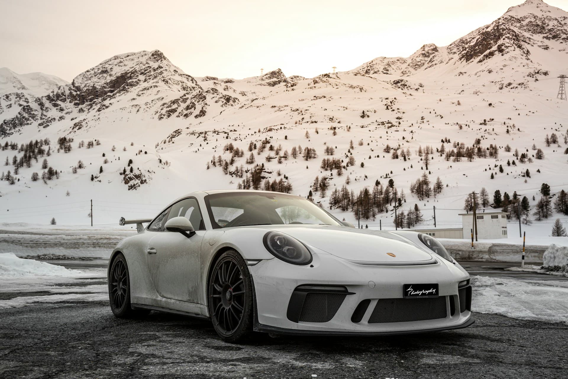 Silver Porsche 911 on an open road